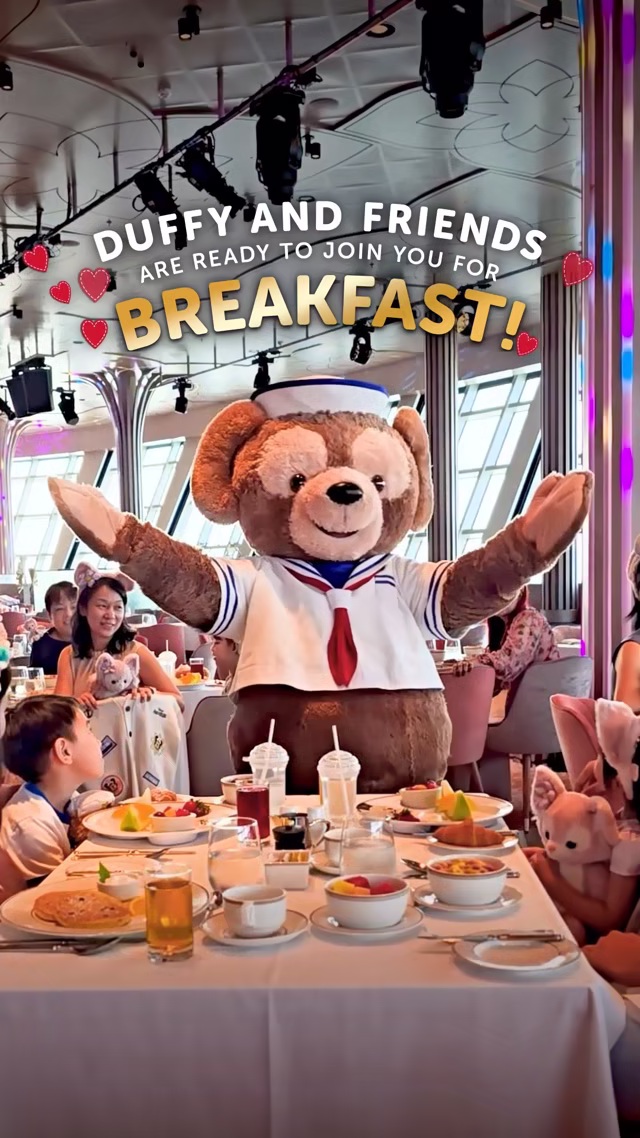 Duffy welcomes guests to the announced breakfast at Hollywood Spotlight Club aboard Disney Adventure