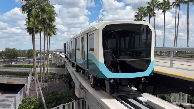 A new Gate Link tram stands at an Orlando International Airport station