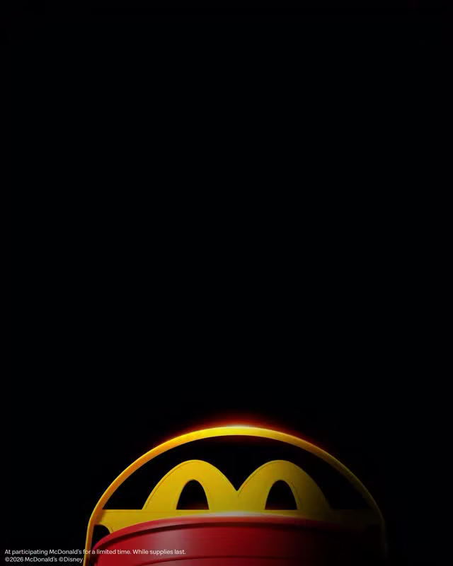 Five pairs of Disney Villains eyes above a McDonald’s Happy Meal pail