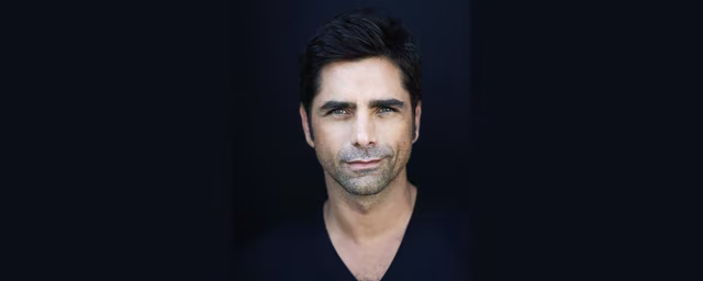 Official Disney portrait of John Stamos