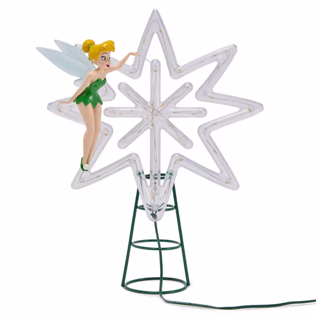 Tinker Bell figure beside a clear illuminated star on a green metal spiral tree-top base