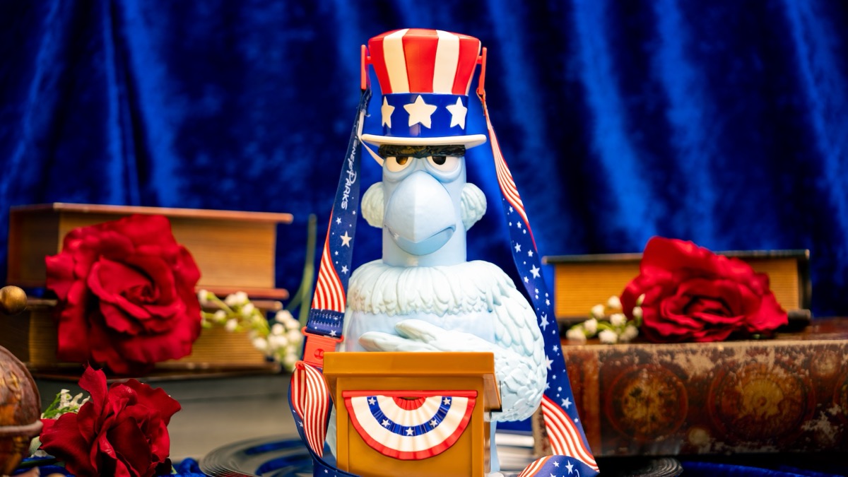 Sam Eagle Bucket with a patriotic top hat, bunting-trimmed podium, and red, white, and blue strap