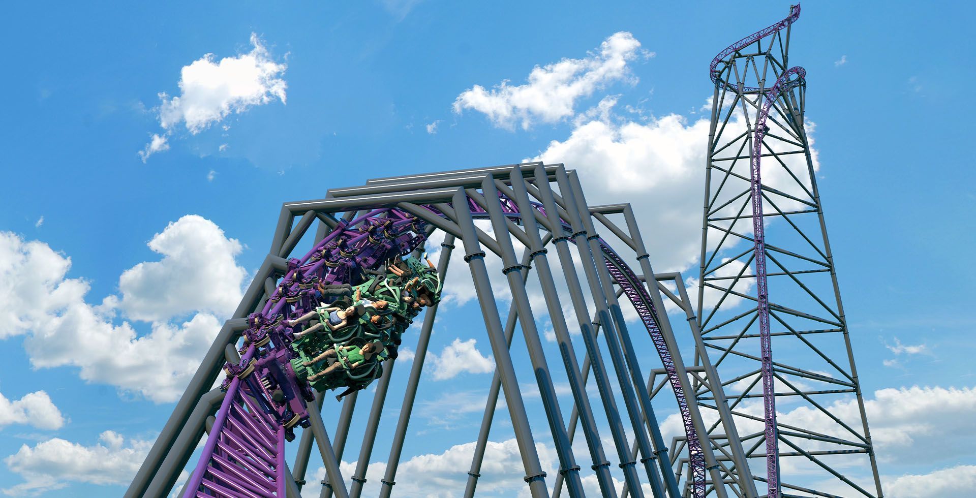 Bakunawa coaster trains spinning through purple track beside the 382-foot tower at Six Flags Great Adventure