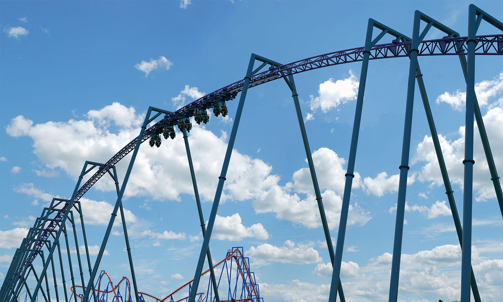Concept rendering of Bakunawa riders accelerating while inverted on purple track