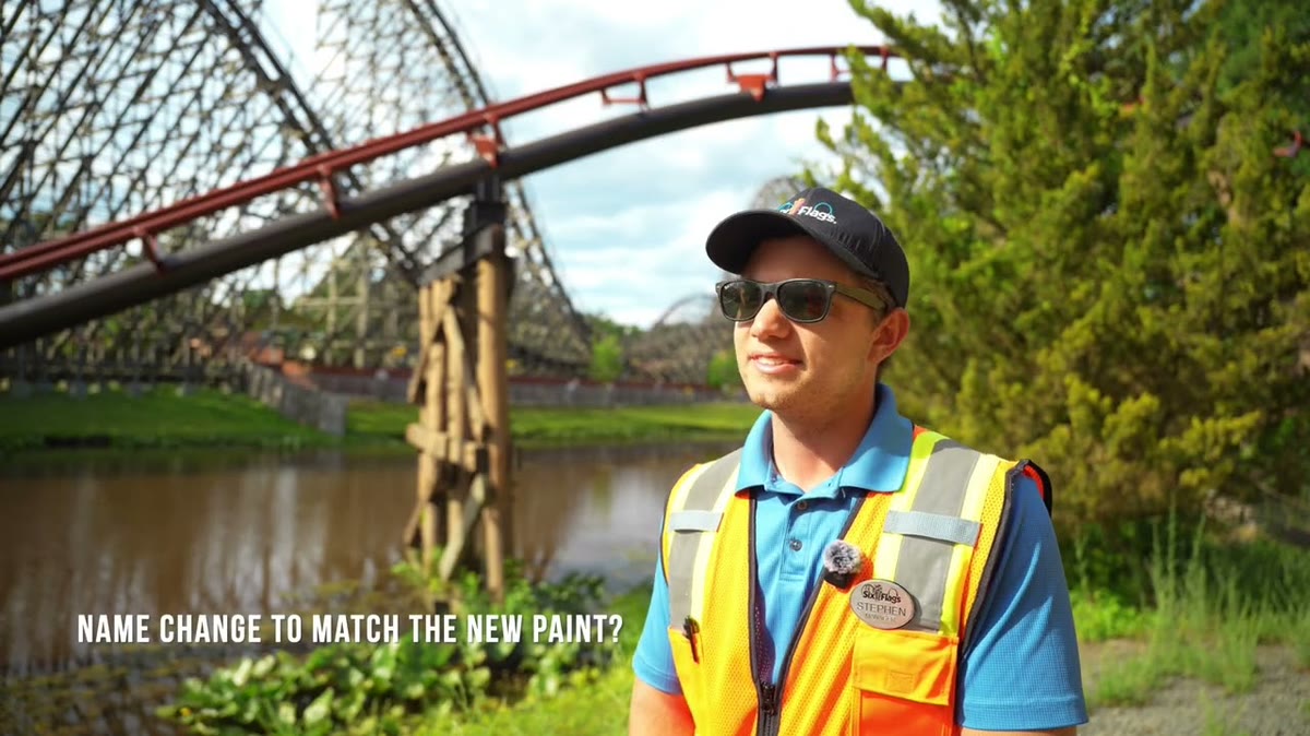 Runaway Mine Train track and a Six Flags Great Adventure team member in an official repaint video still
