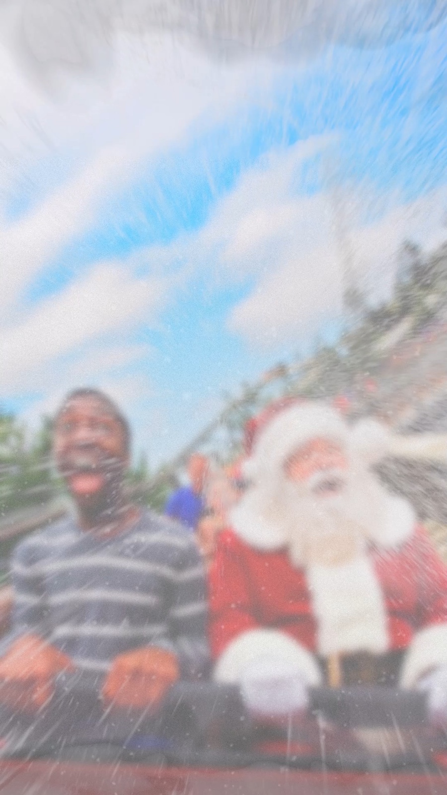 Two riders on a water attraction at Six Flags New England