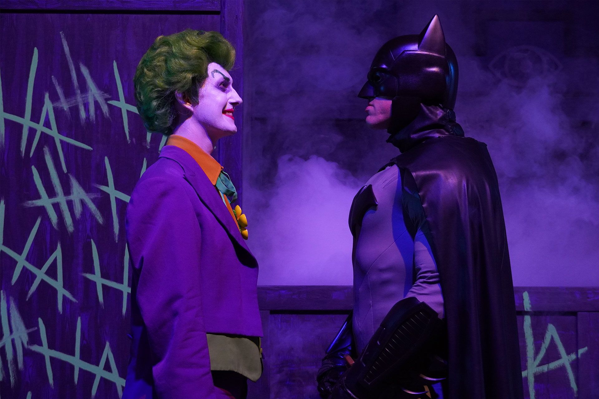Batman and The Joker face each other during DC Heroes and Villains Fest