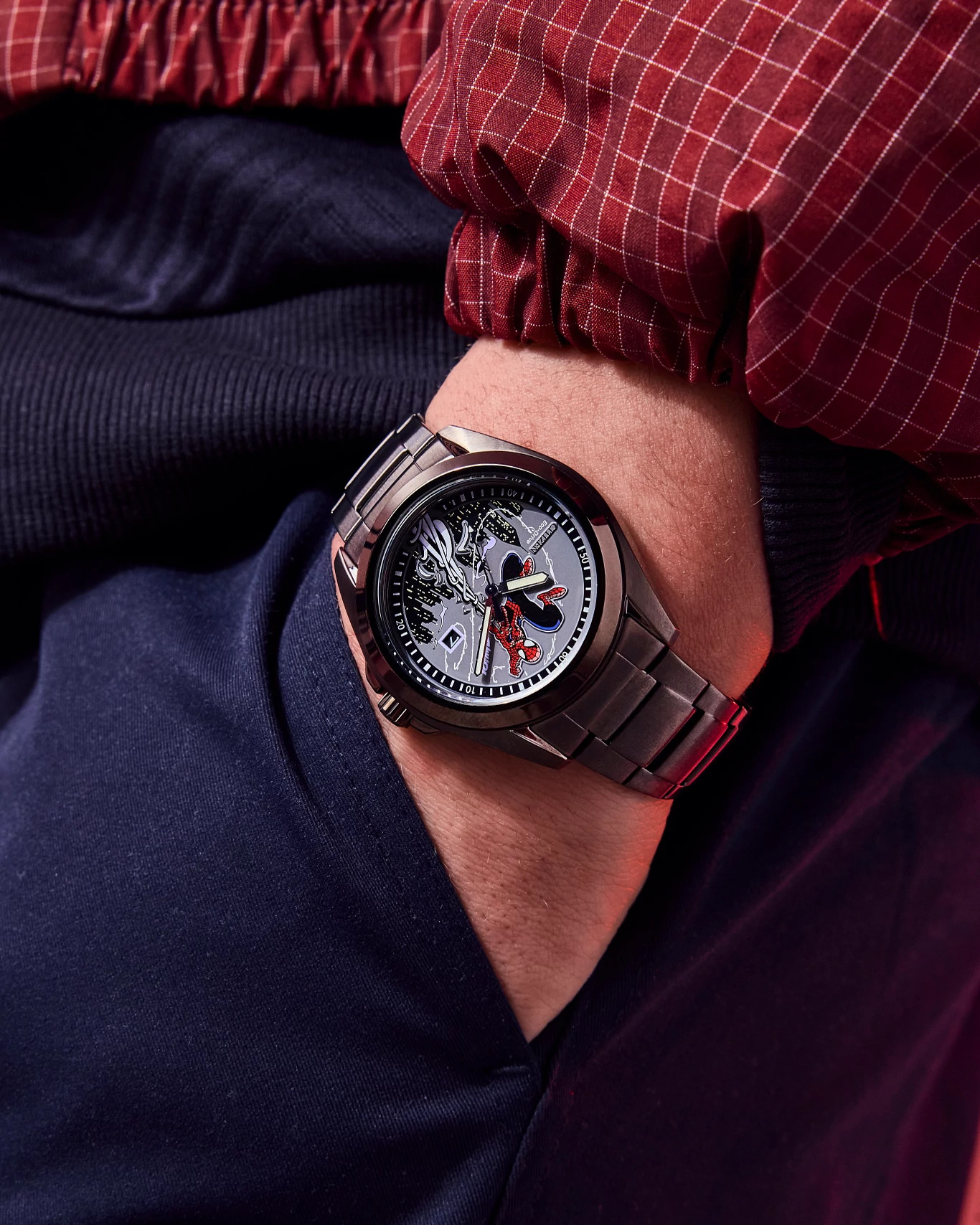 Citizen Spider-Man watch worn with a red web-patterned shirt