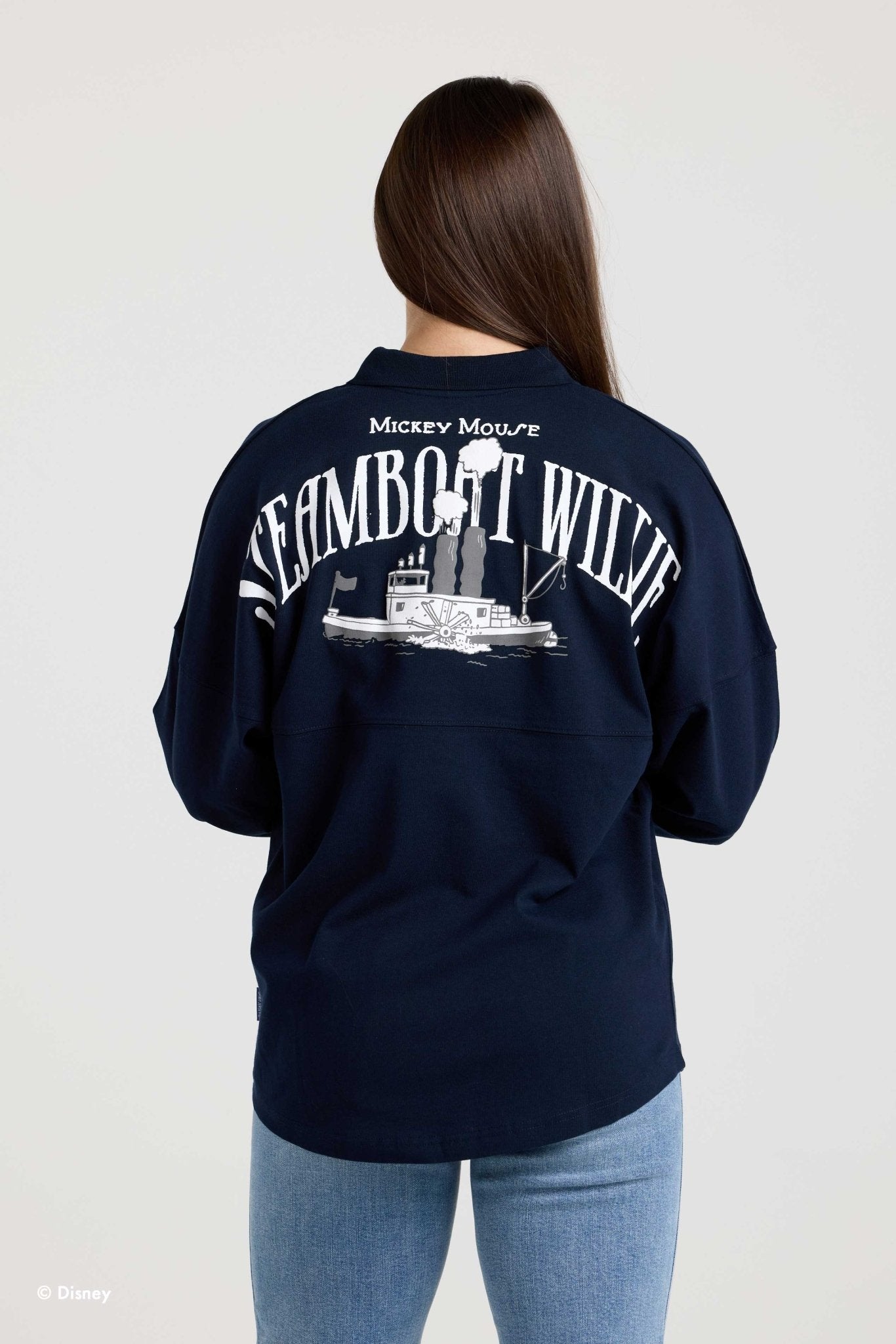 Back of the navy Steamboat Willie collared Spirit Jersey on a model