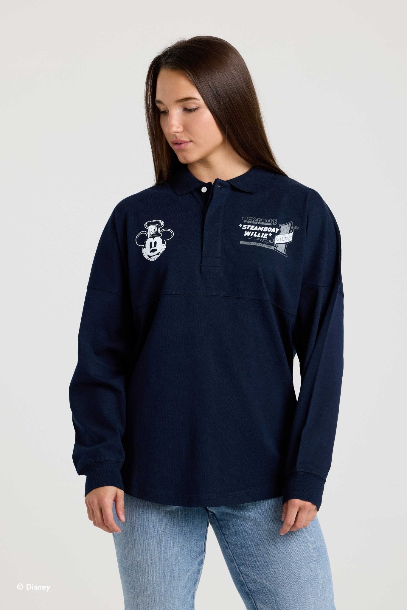 Front of the navy Steamboat Willie collared Spirit Jersey on a model