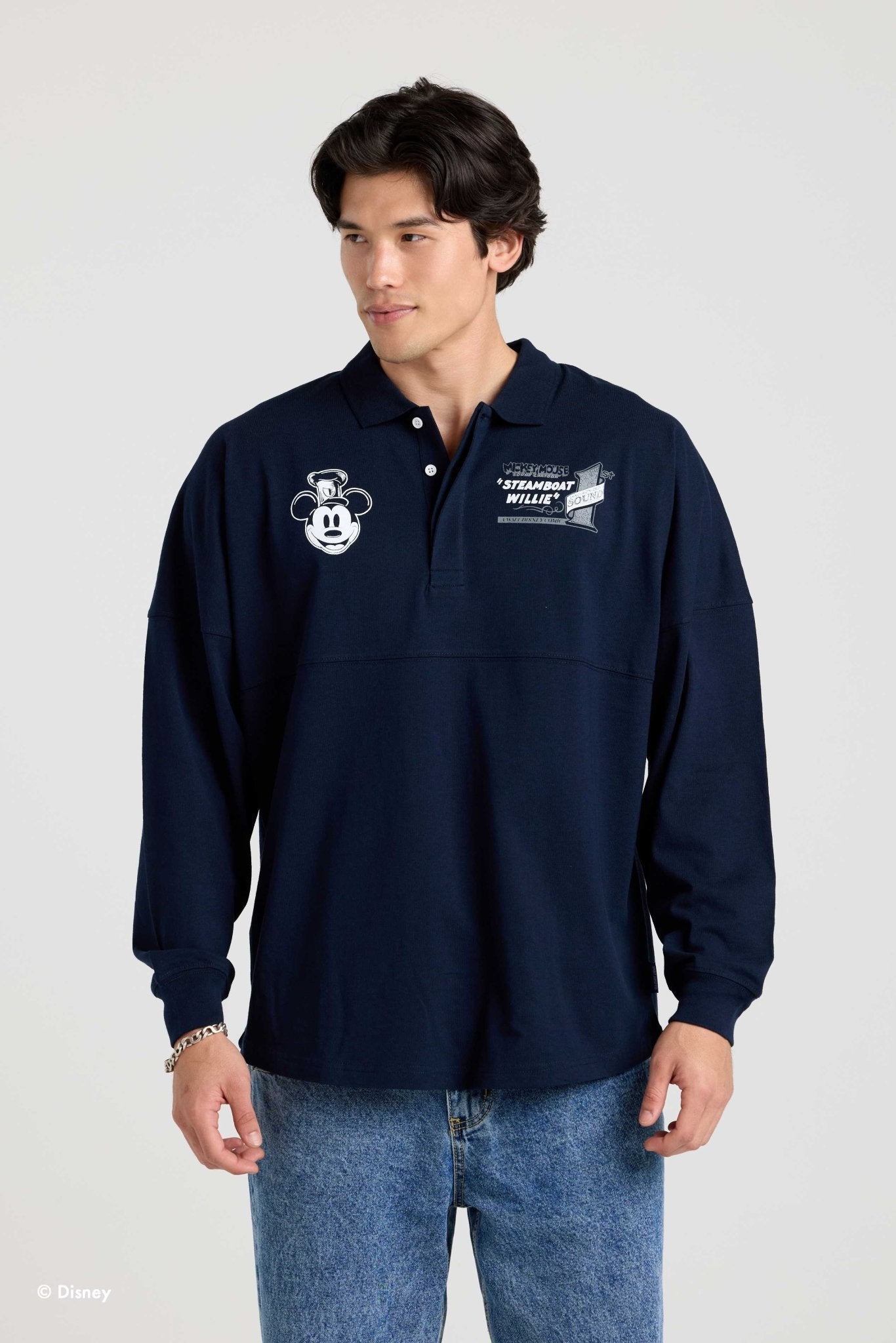 Front of the navy Steamboat Willie collared Spirit Jersey on a second model