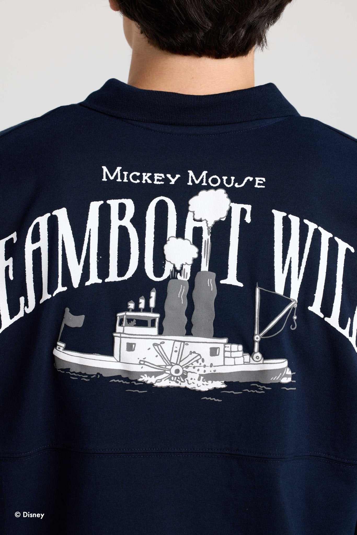 Steamboat Willie title and boat graphic across the back of the collared Spirit Jersey