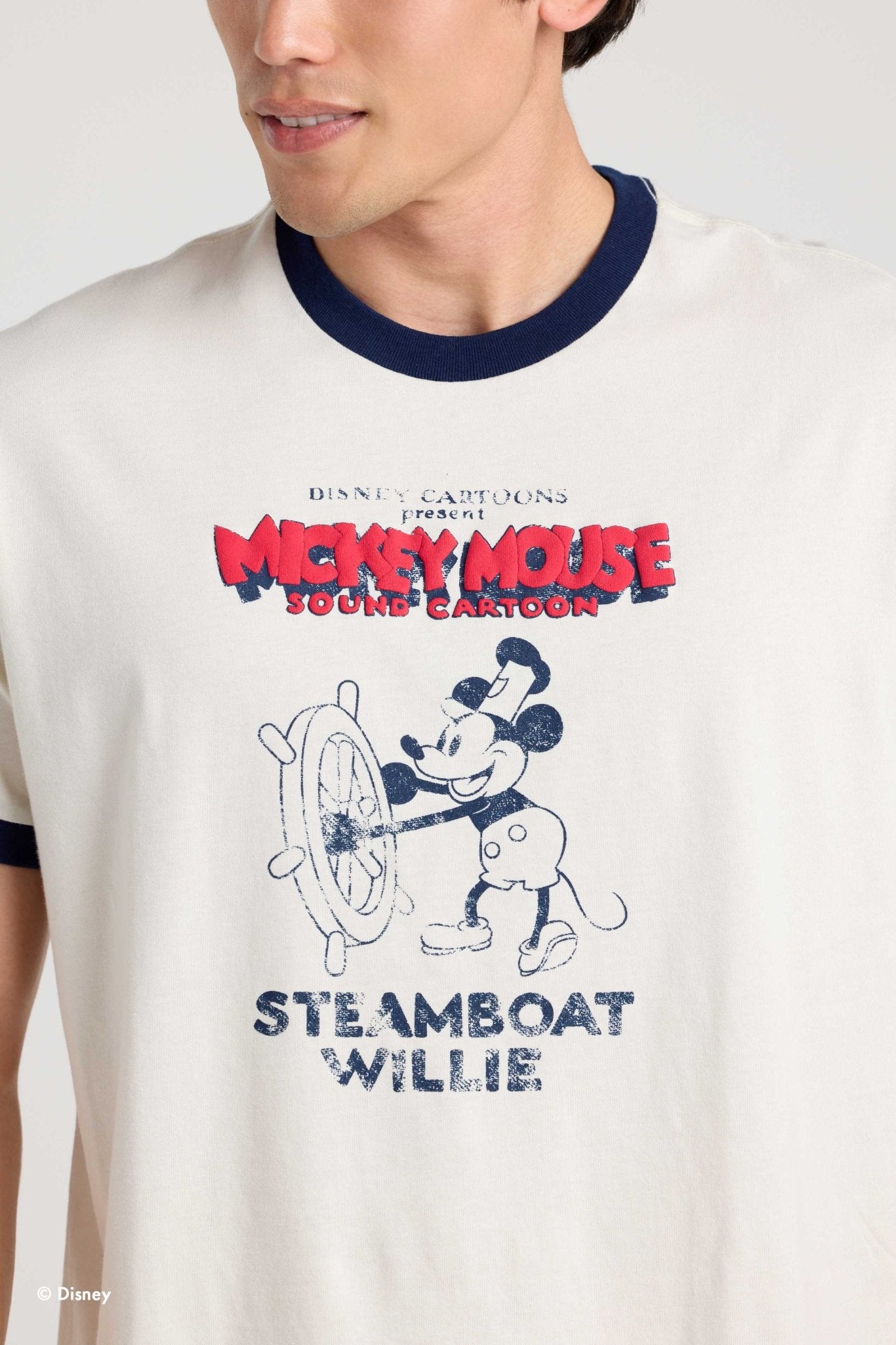 Close view of the Mickey Mouse graphic on the Steamboat Willie ringer tee