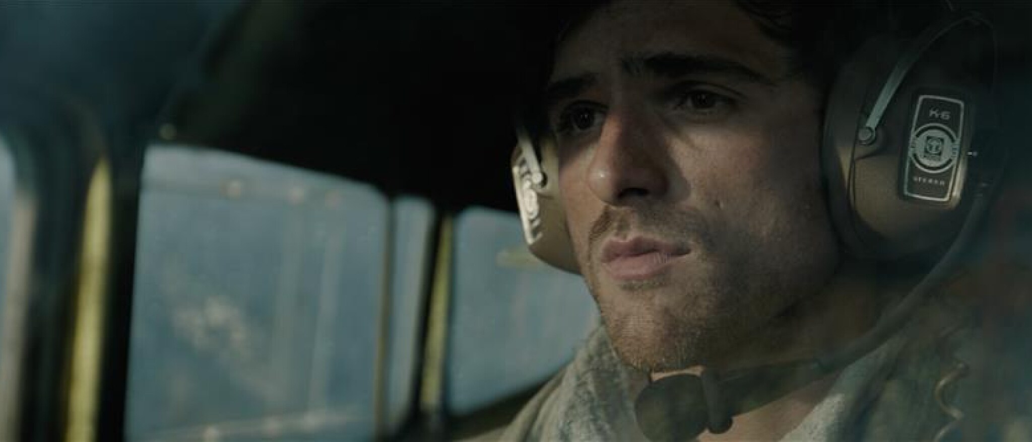 Jacob Elordi as Hig in The Dog Stars, seated inside a plane cockpit