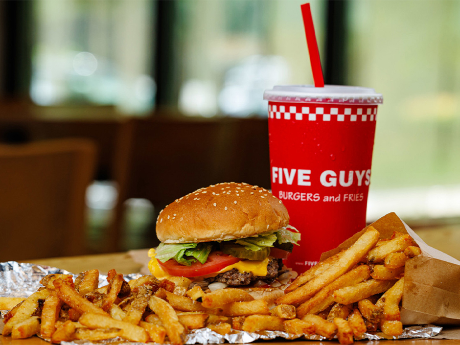 Five Guys burger, fries and drink in Universal promotional photo