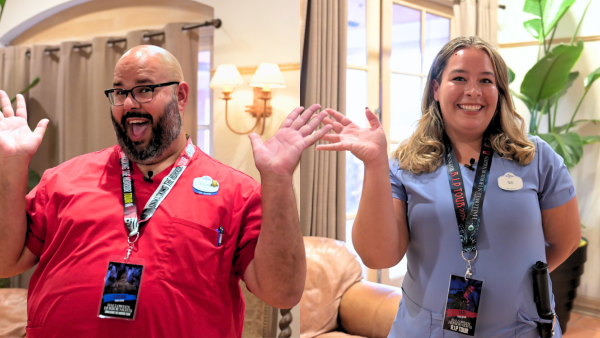 Two Universal Orlando VIP tour guides wearing R.I.P. Tour credentials
