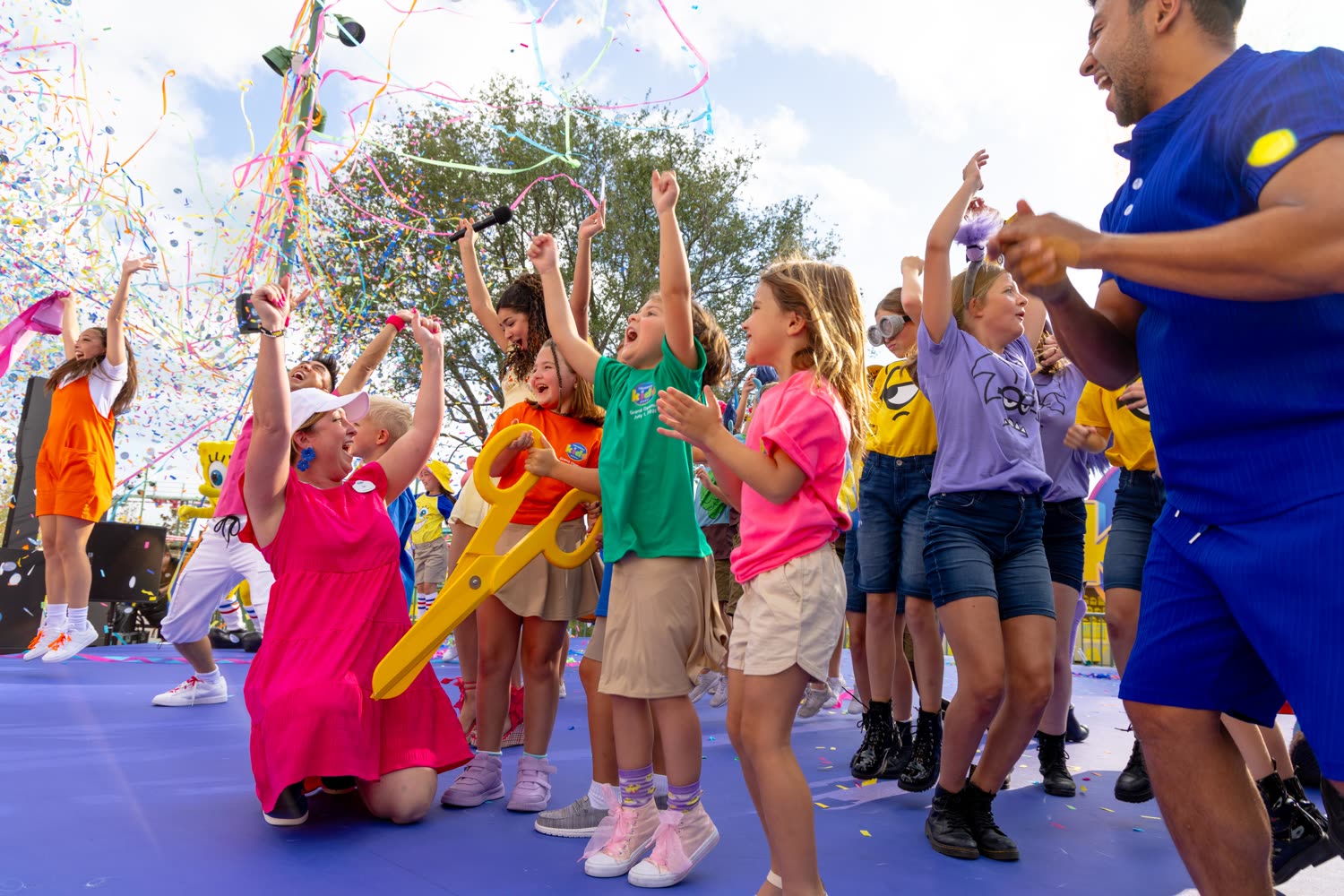 Children cheer during the Universal Kids Resort opening-day celebration in Frisco