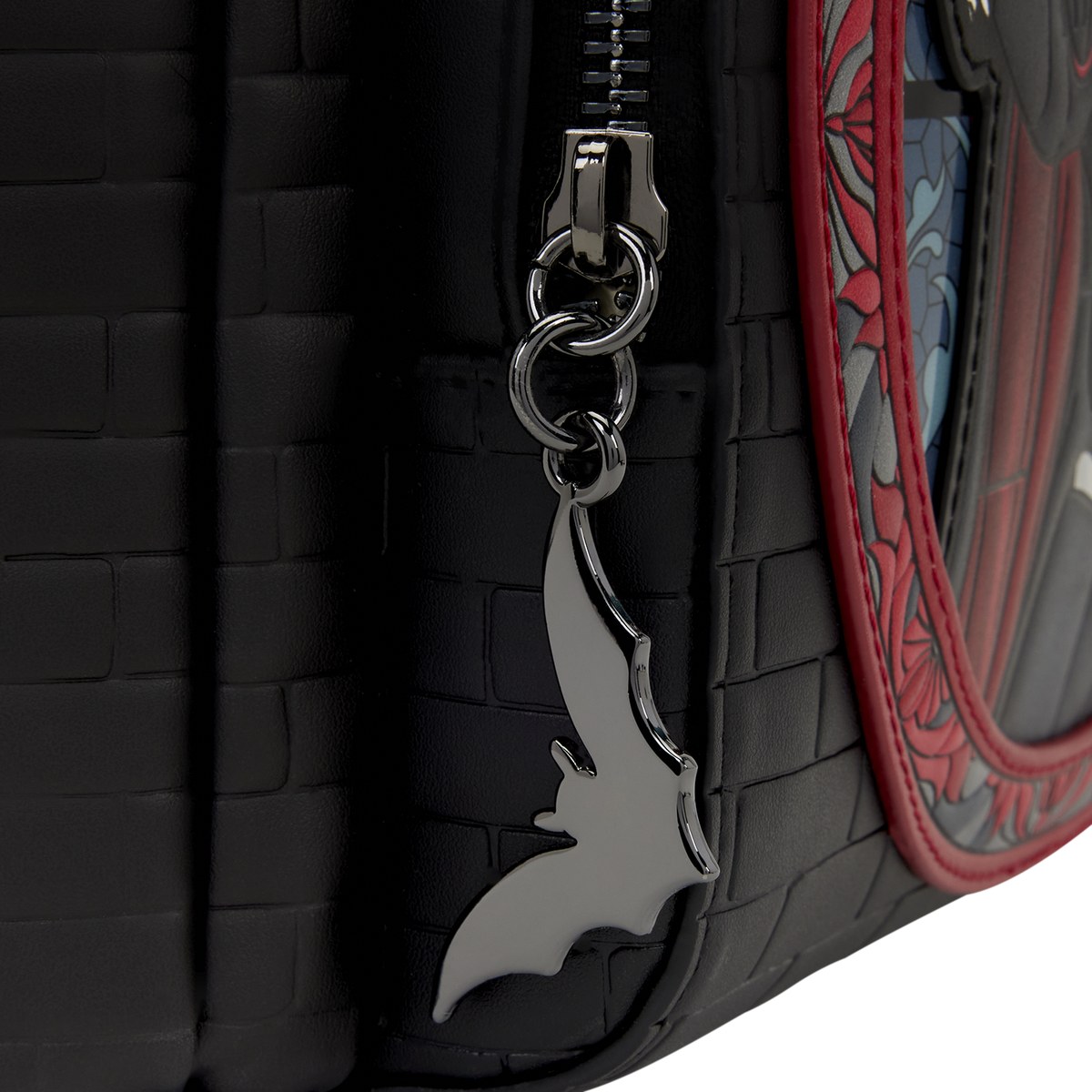 Bat zipper charm on the Dracula mini backpack