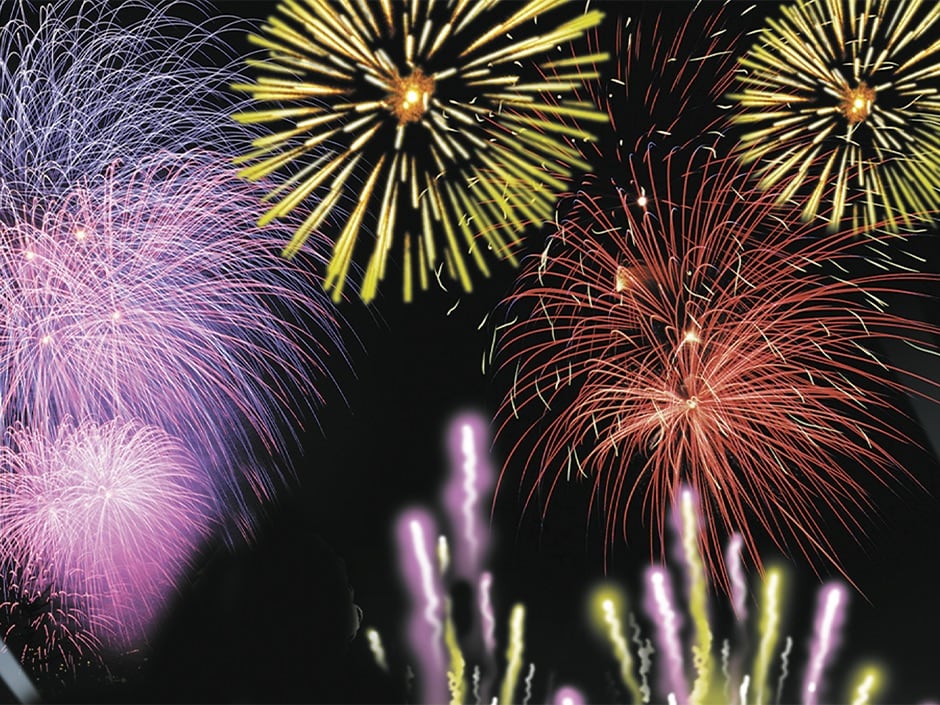 Fireworks burst over Universal Orlando Resort during a nighttime celebration