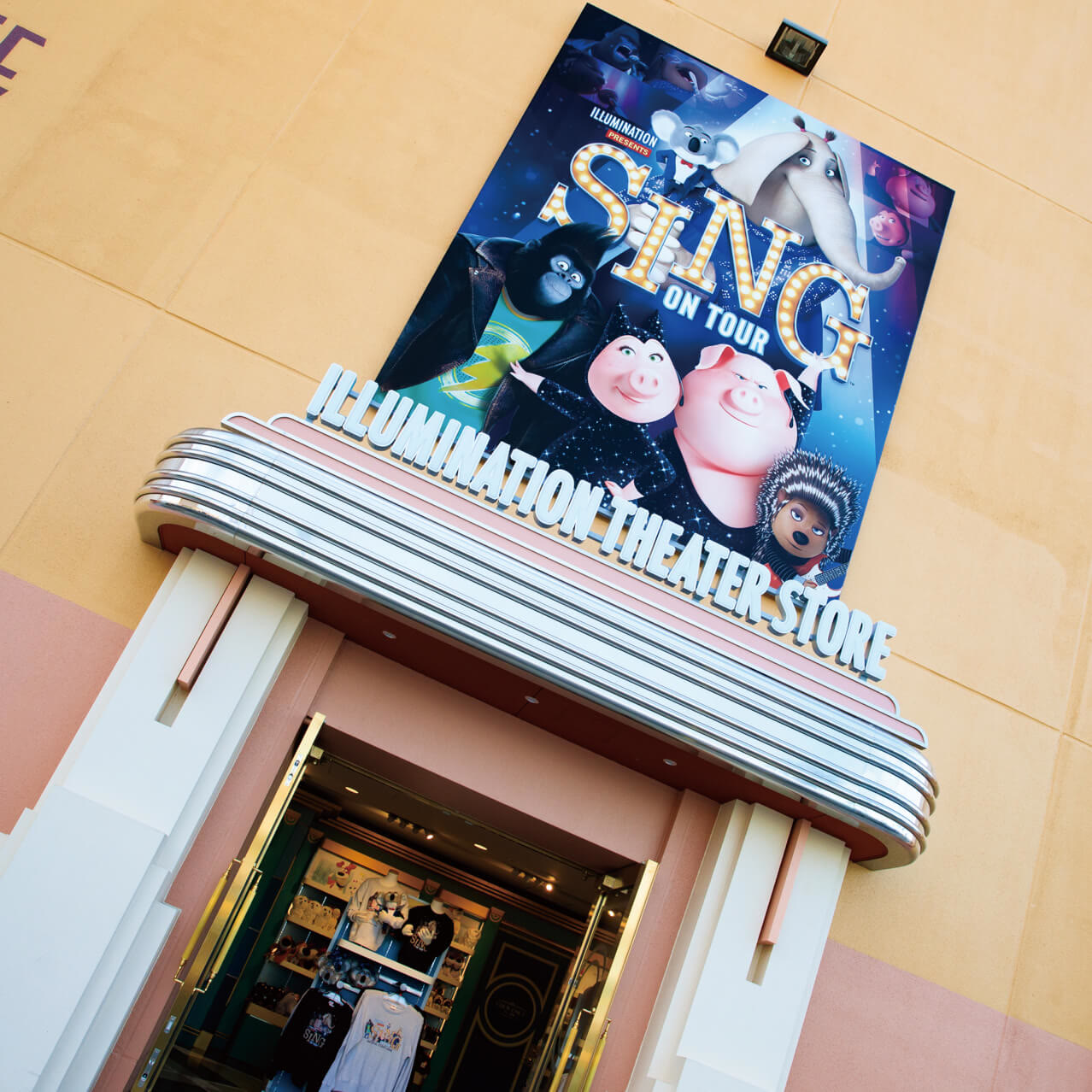 Entrance to Illumination Theater Store with Sing character sign