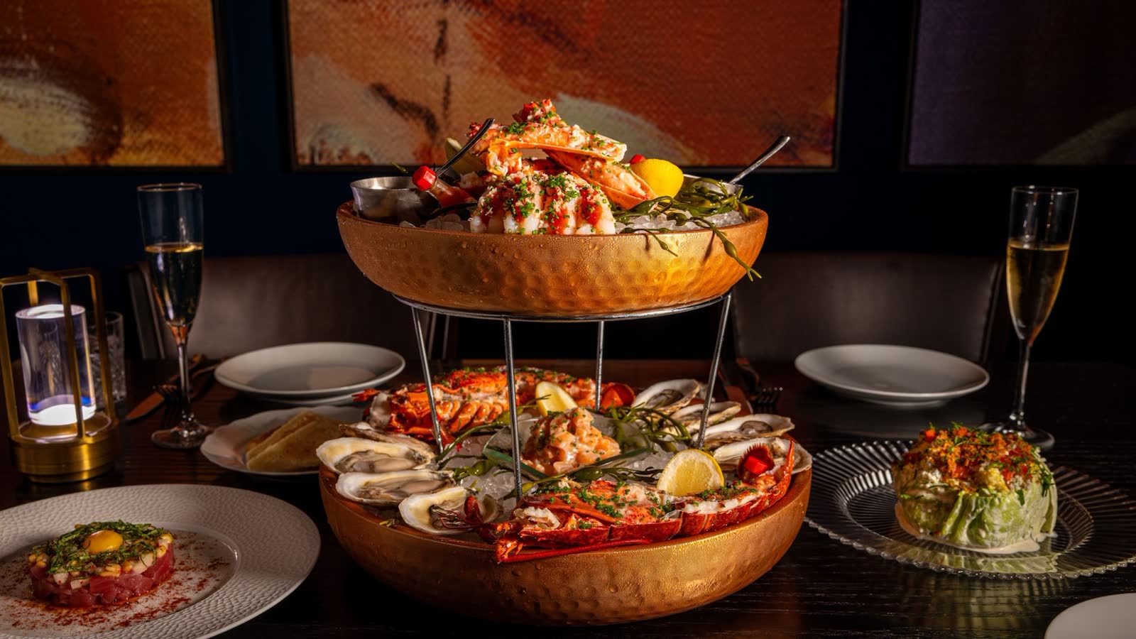 Seafood tower and plated dishes at Bourbon Steak inside Walt Disney World Dolphin