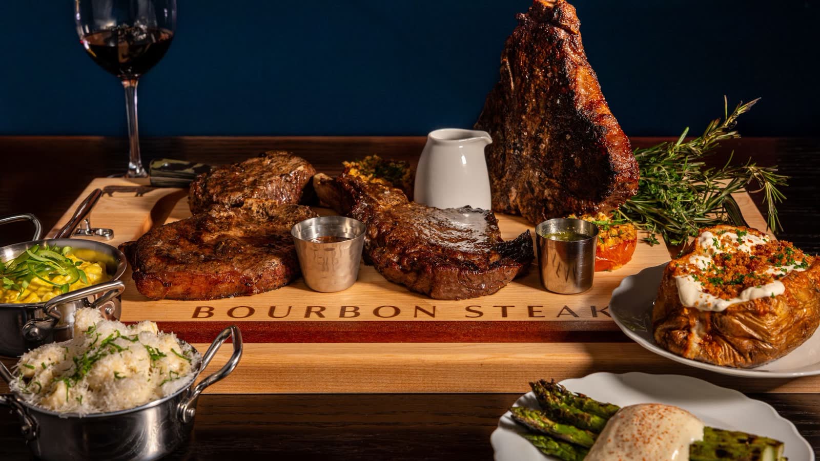 Bourbon Steak table service with entrees and sides at Walt Disney World Dolphin